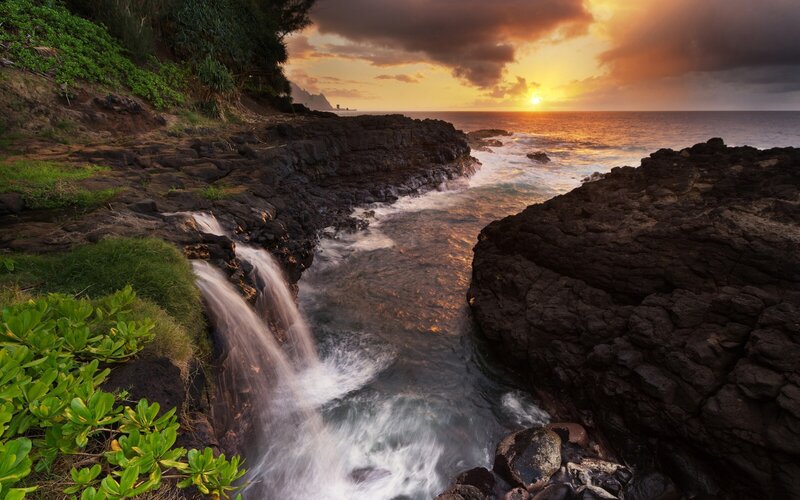 Sunset waterfall at the coast