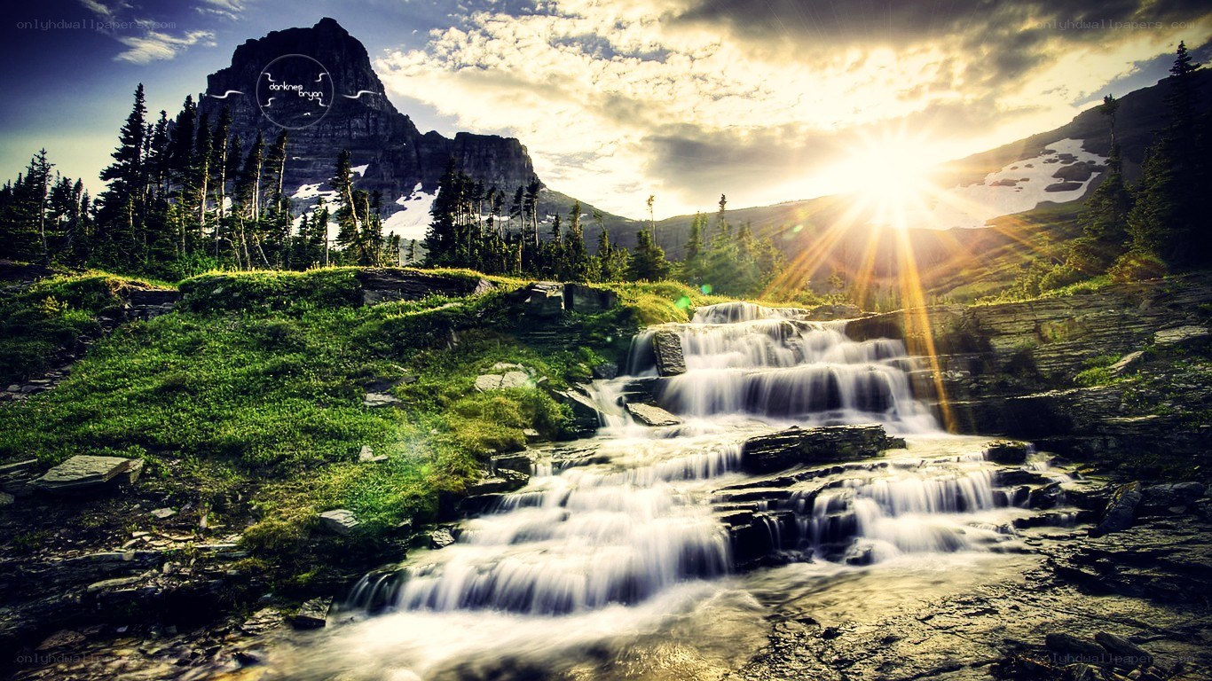 Sunset waterfall in mountain valley