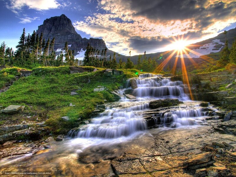 Sunset waterfall in mountain valley