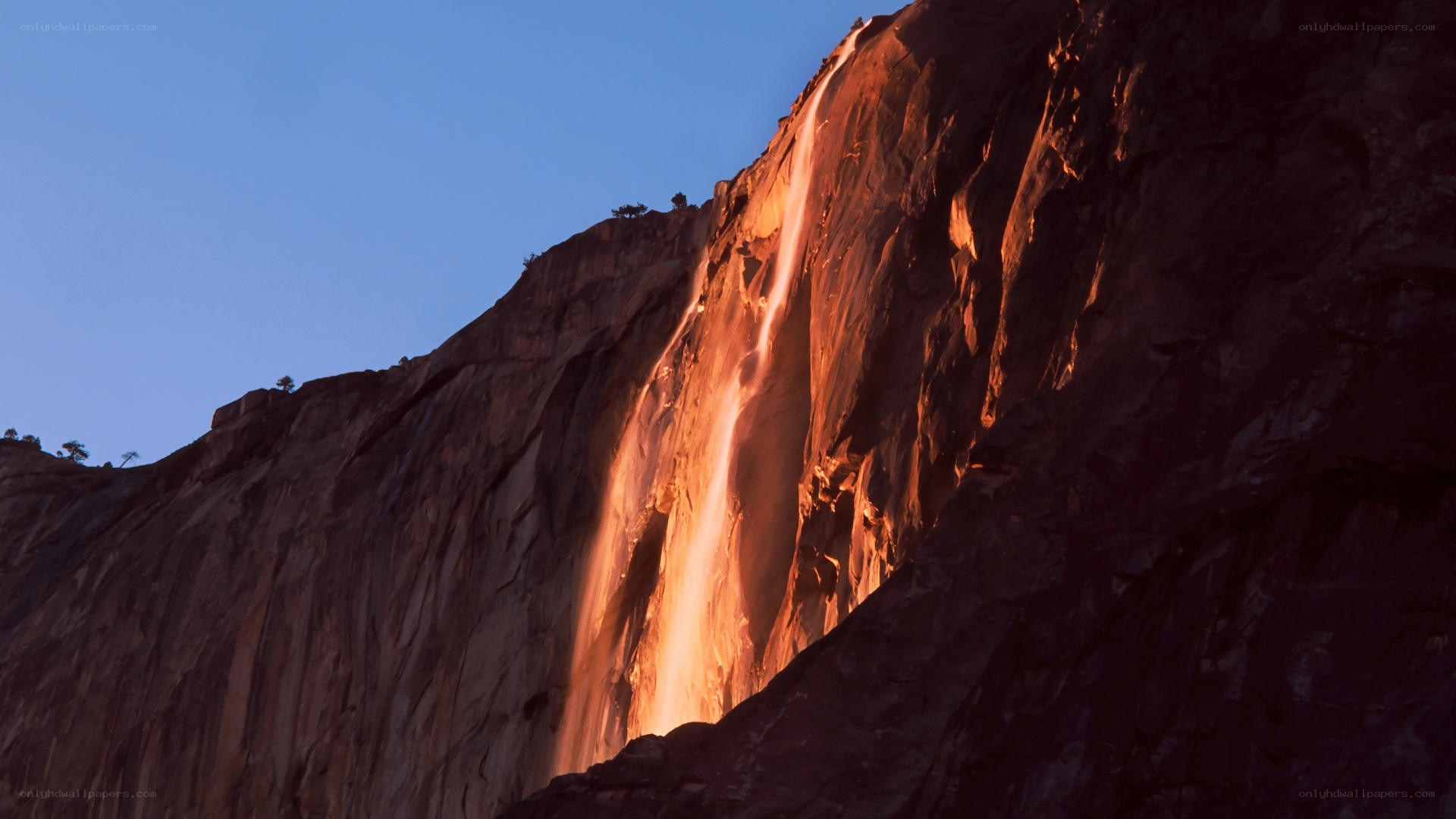 Sunset waterfall on cliff