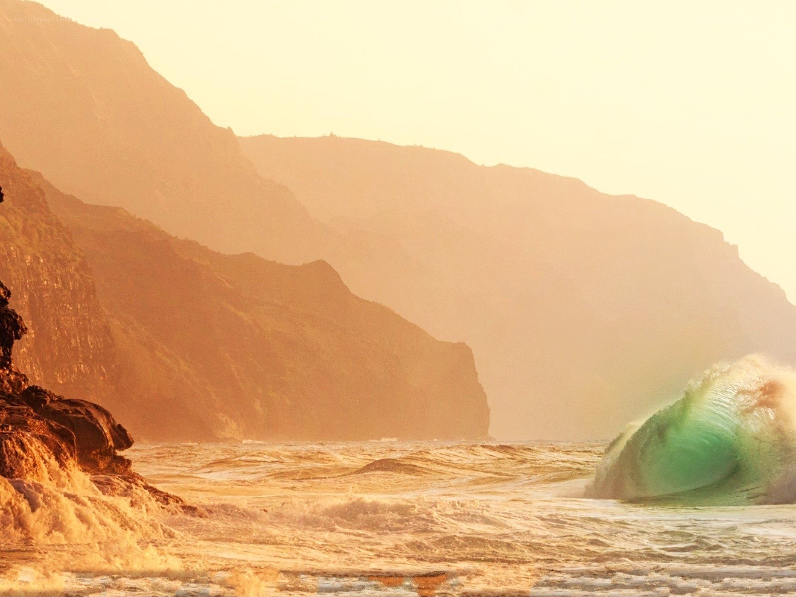 Sunset wave at coastal cliffs