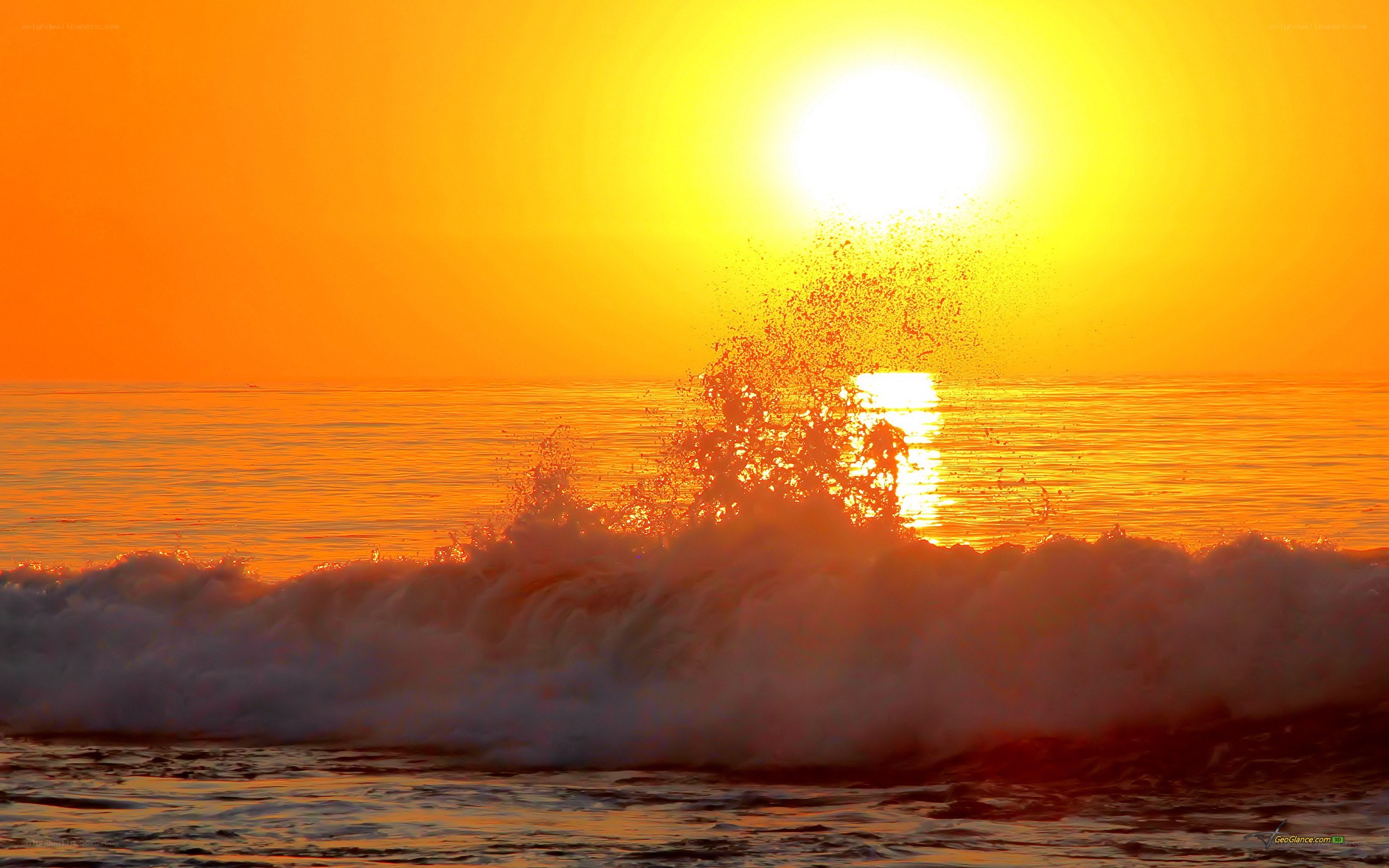 Sunset wave crashing on shore