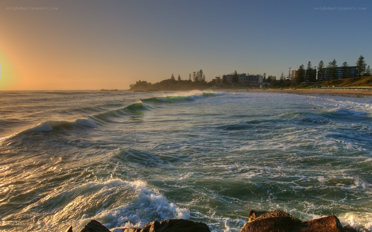 Sunset waves at coastal town