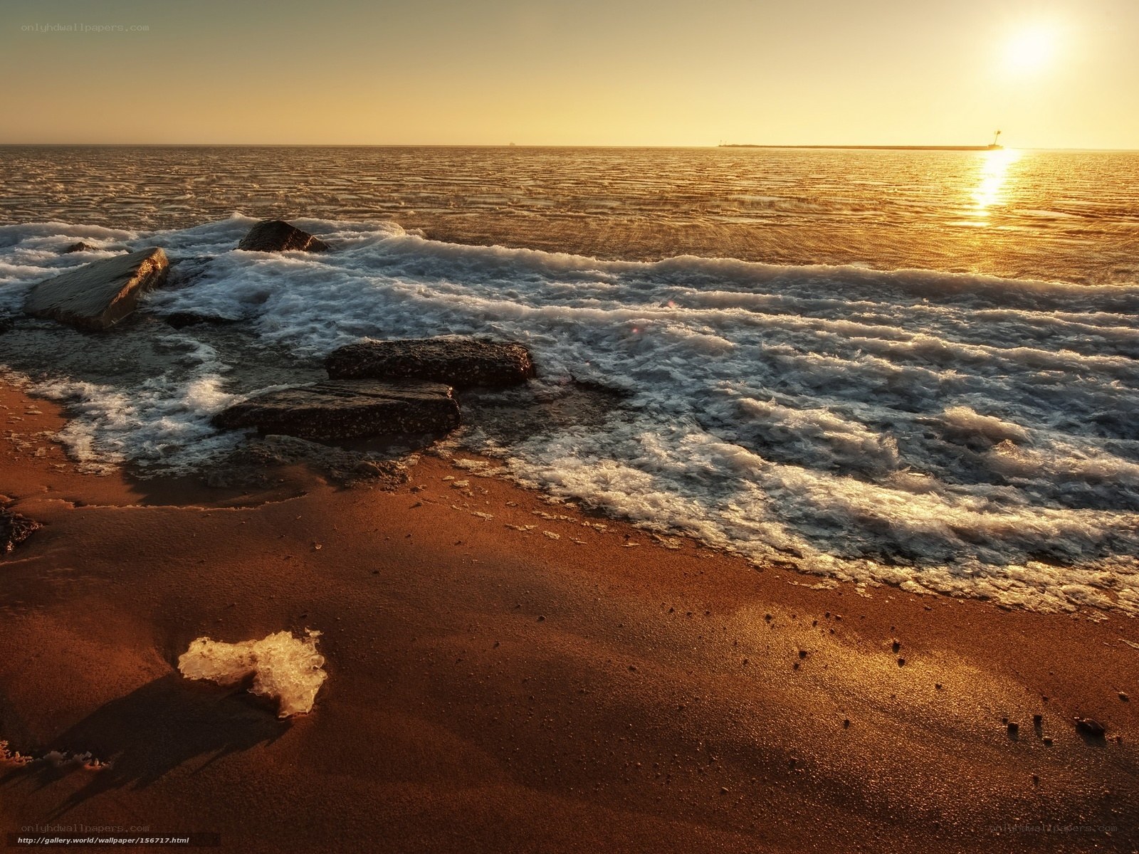 Sunset waves on a rocky beach