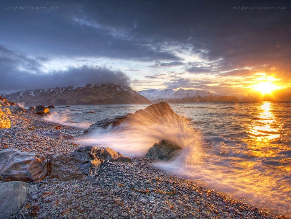 Sunset waves on a rocky shore