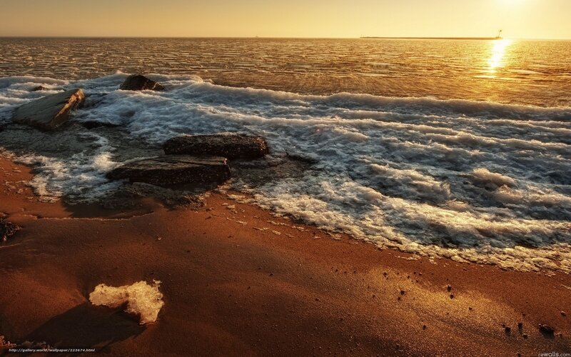Sunset waves on a rocky shore