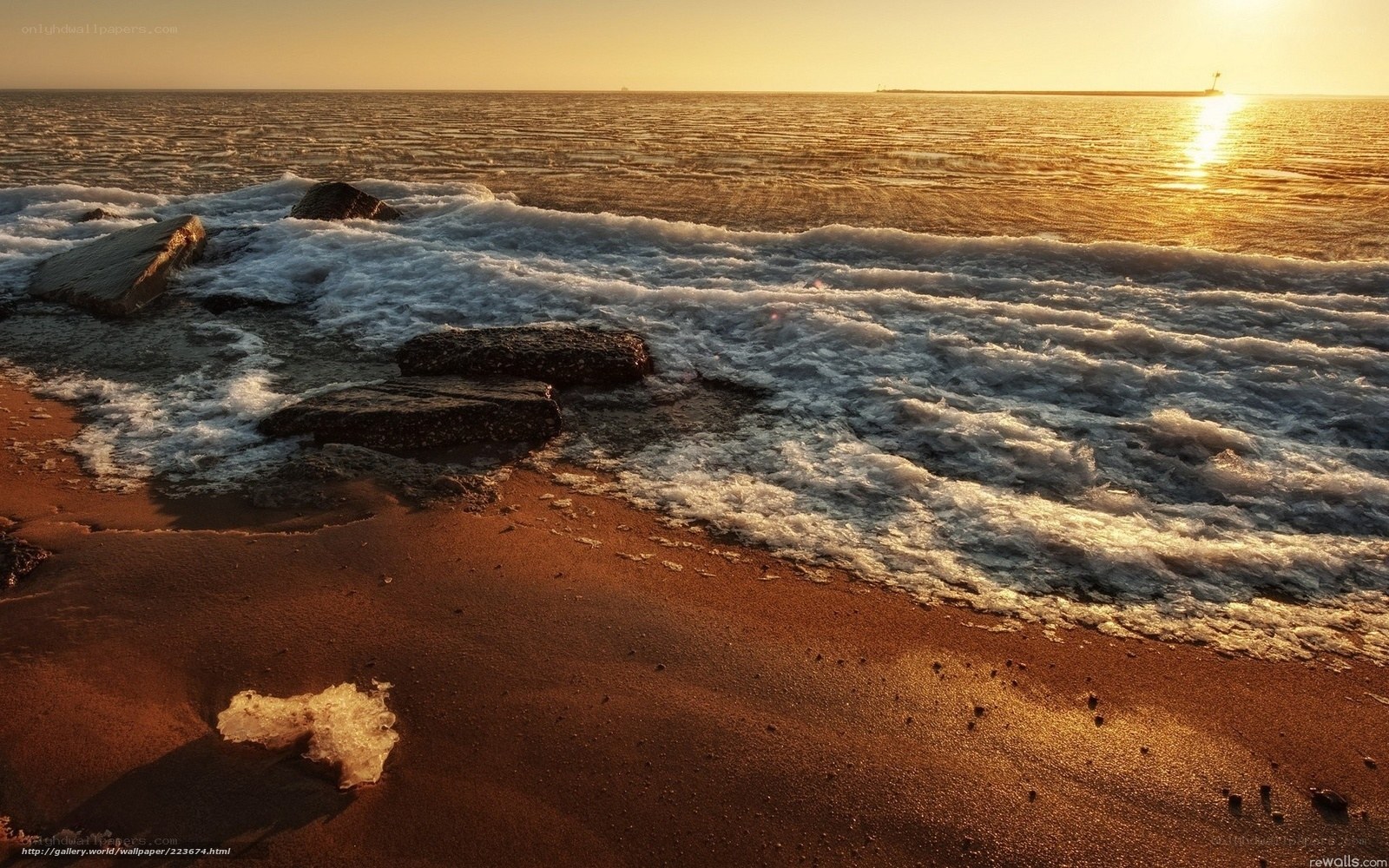 Sunset waves on a rocky shore
