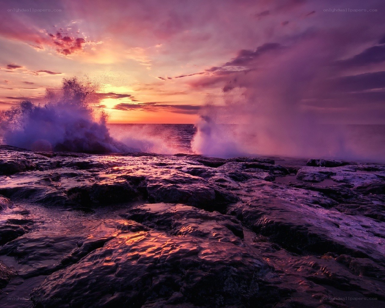Sunset waves on rocky shore