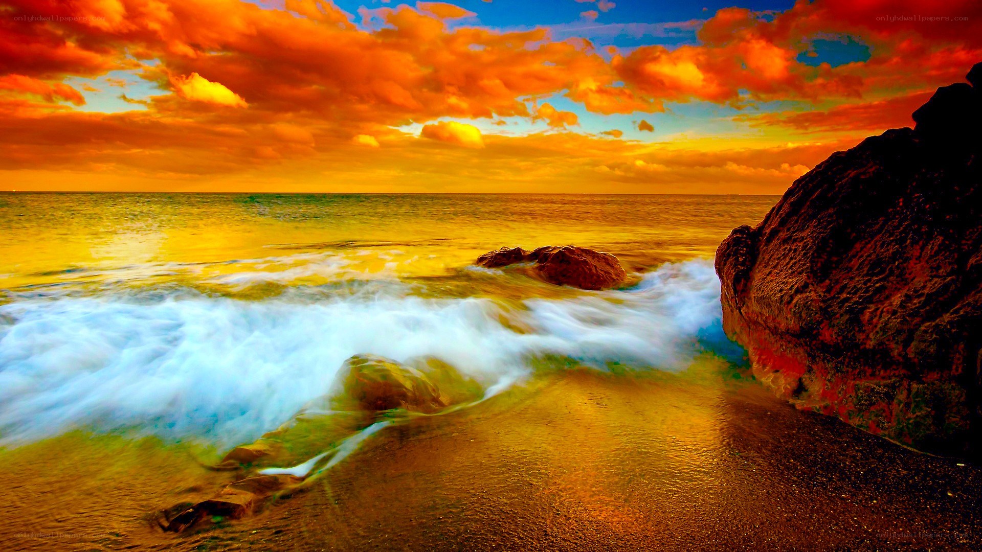Sunset waves on rocky shore