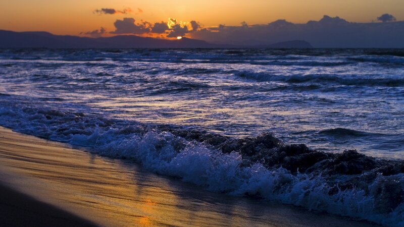 Sunset waves on the beach