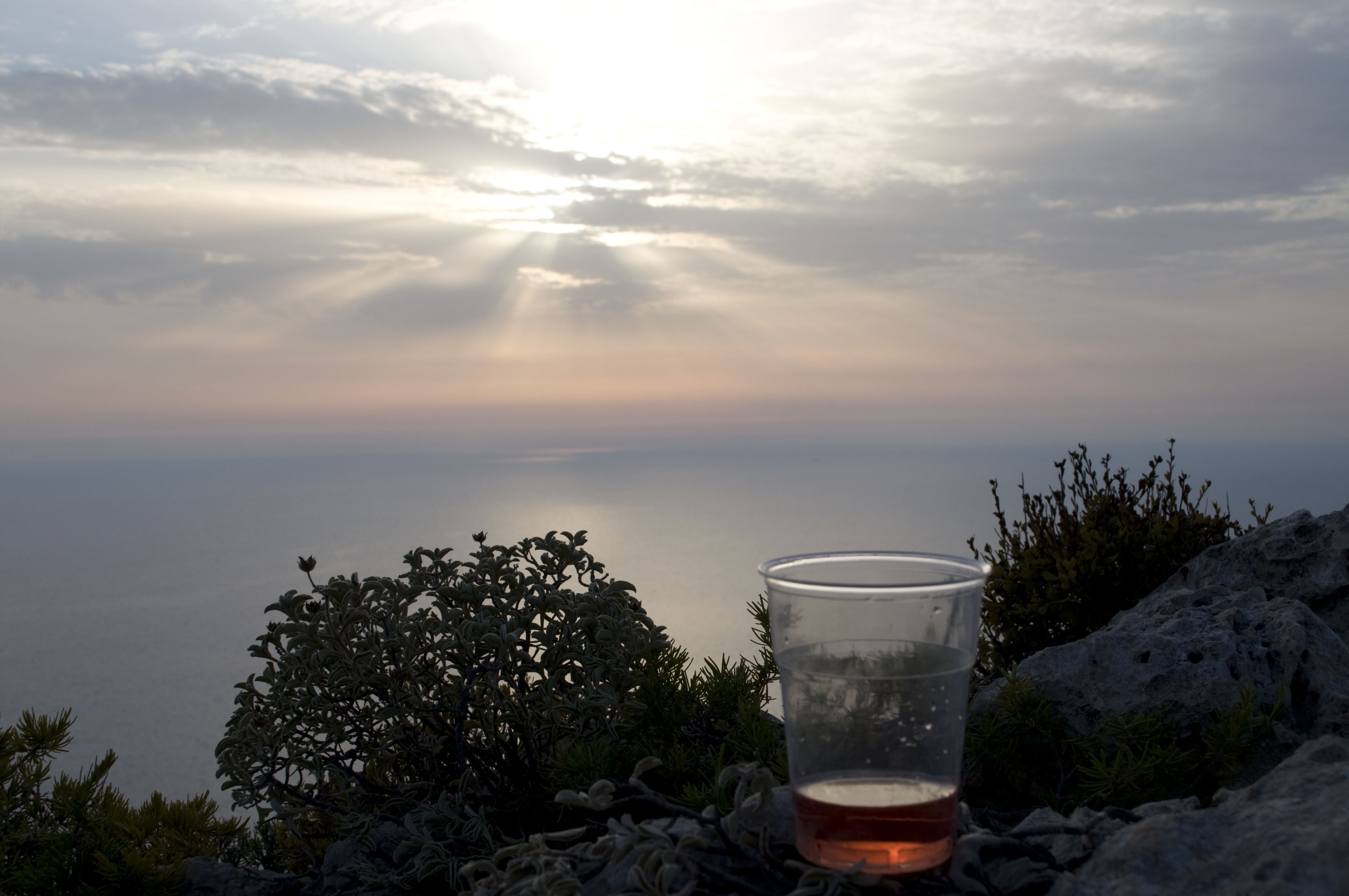 Sunset with a drink on the cliff