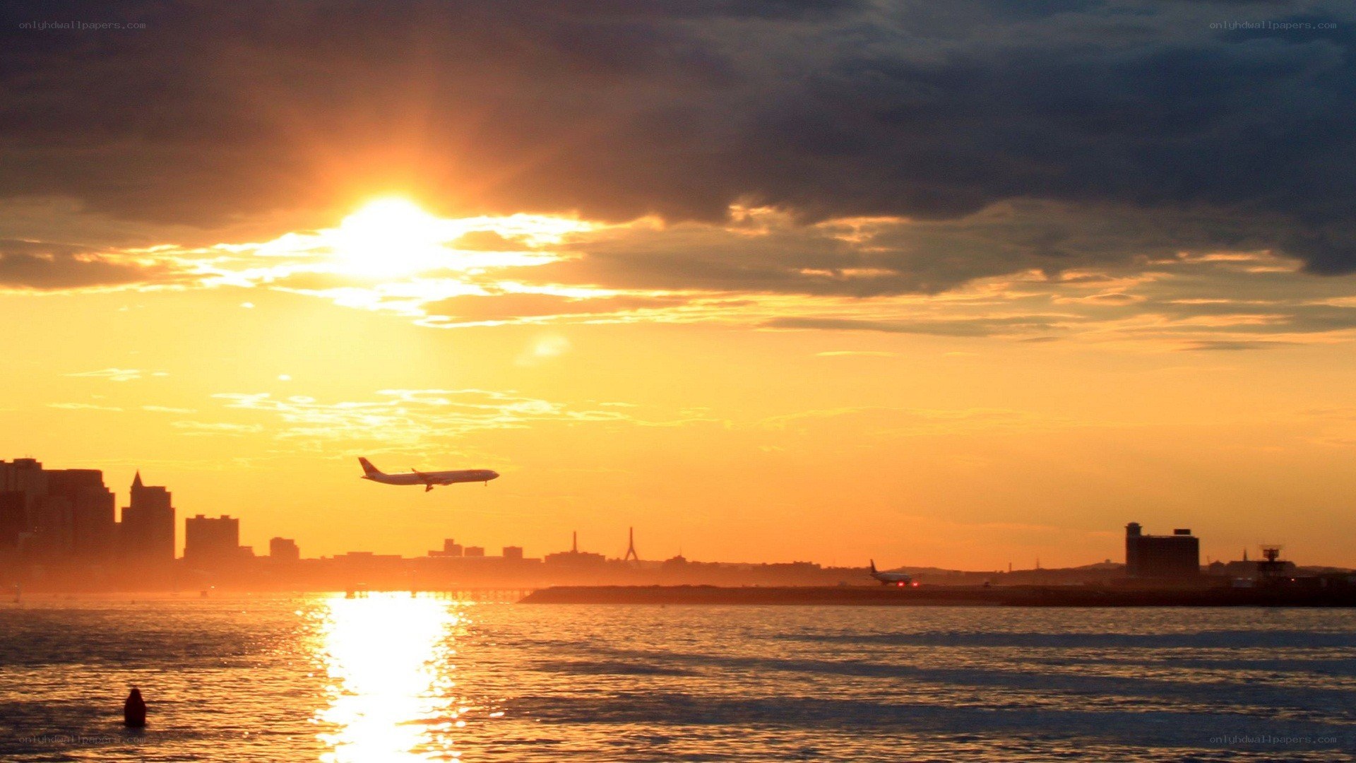 Sunset with airplane over water