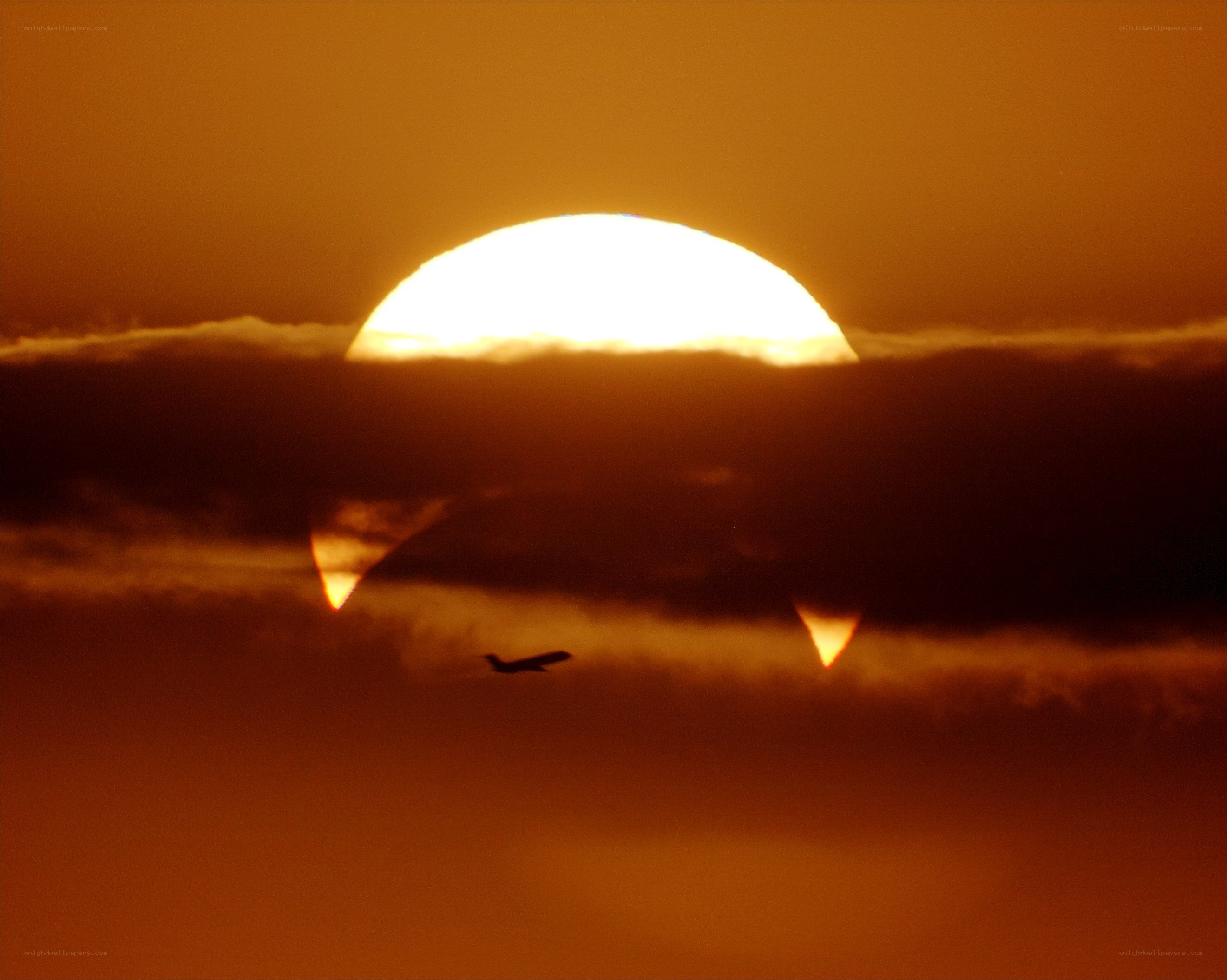 Sunset with airplane silhouette