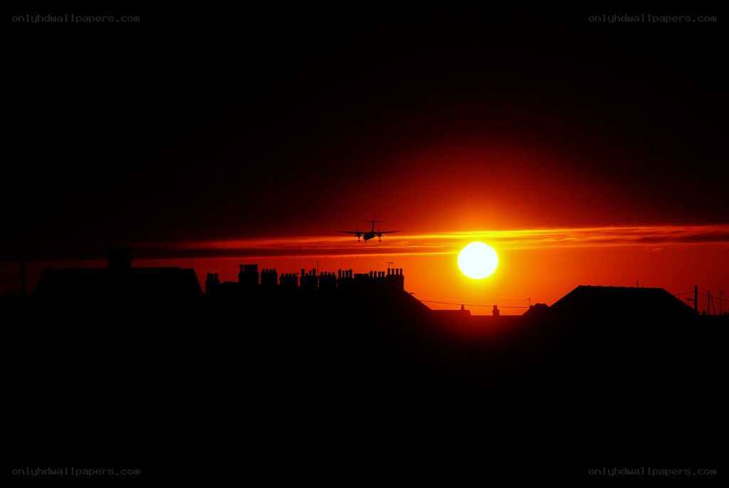 Sunset with airplane silhouette