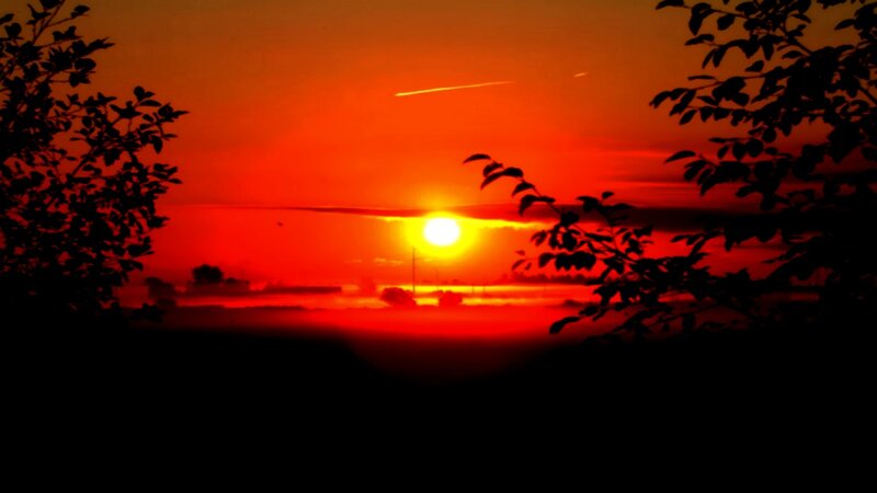 sunset with airplane trail