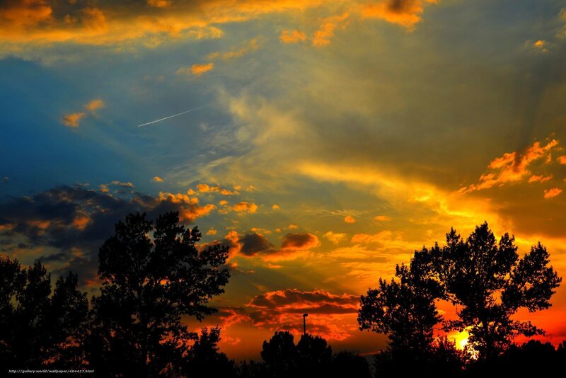 Sunset with airplane trail