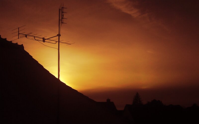 Sunset with antenna silhouette