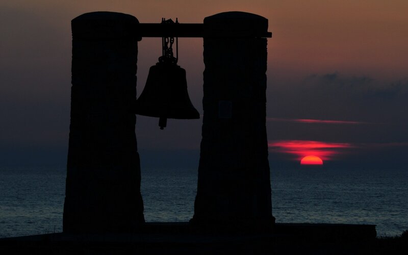 Sunset with bell silhouette