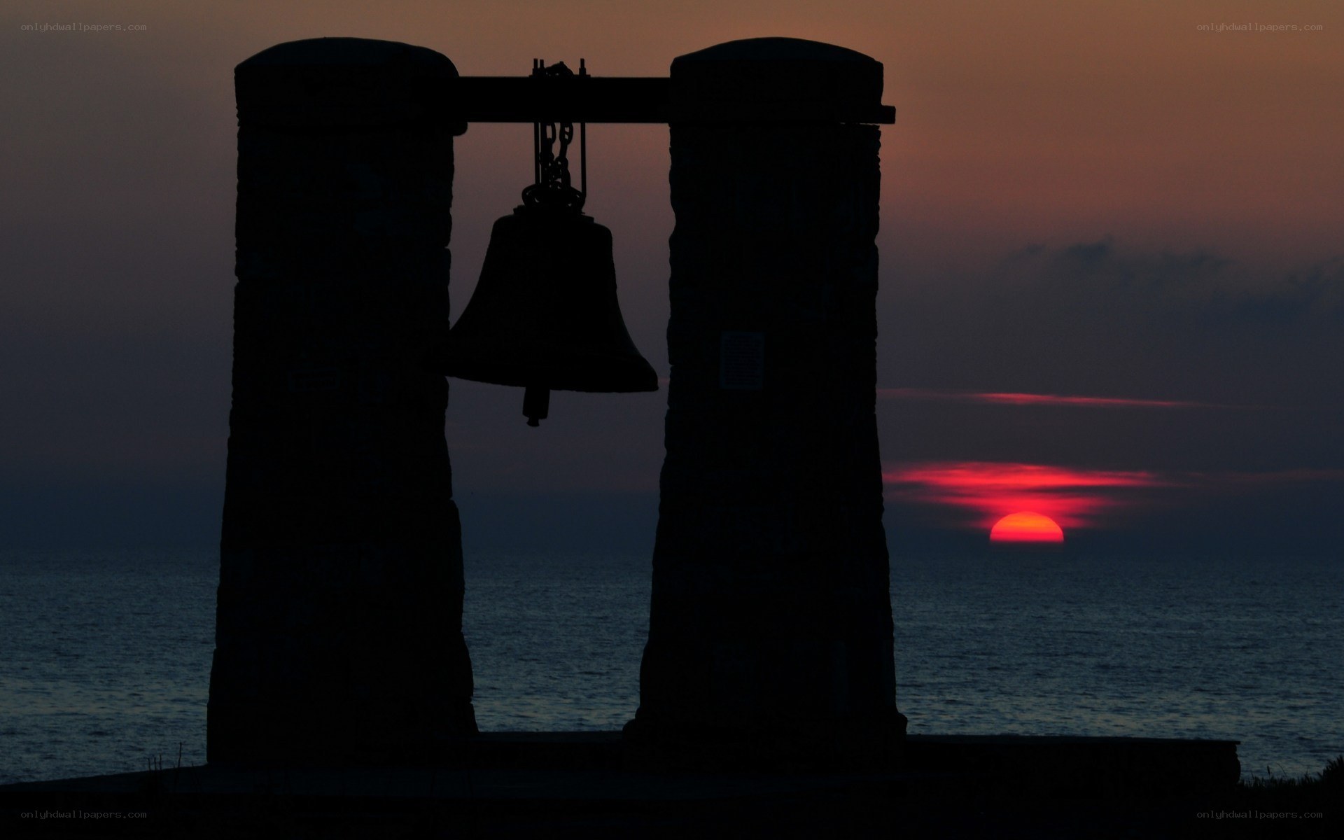 Sunset with bell silhouette