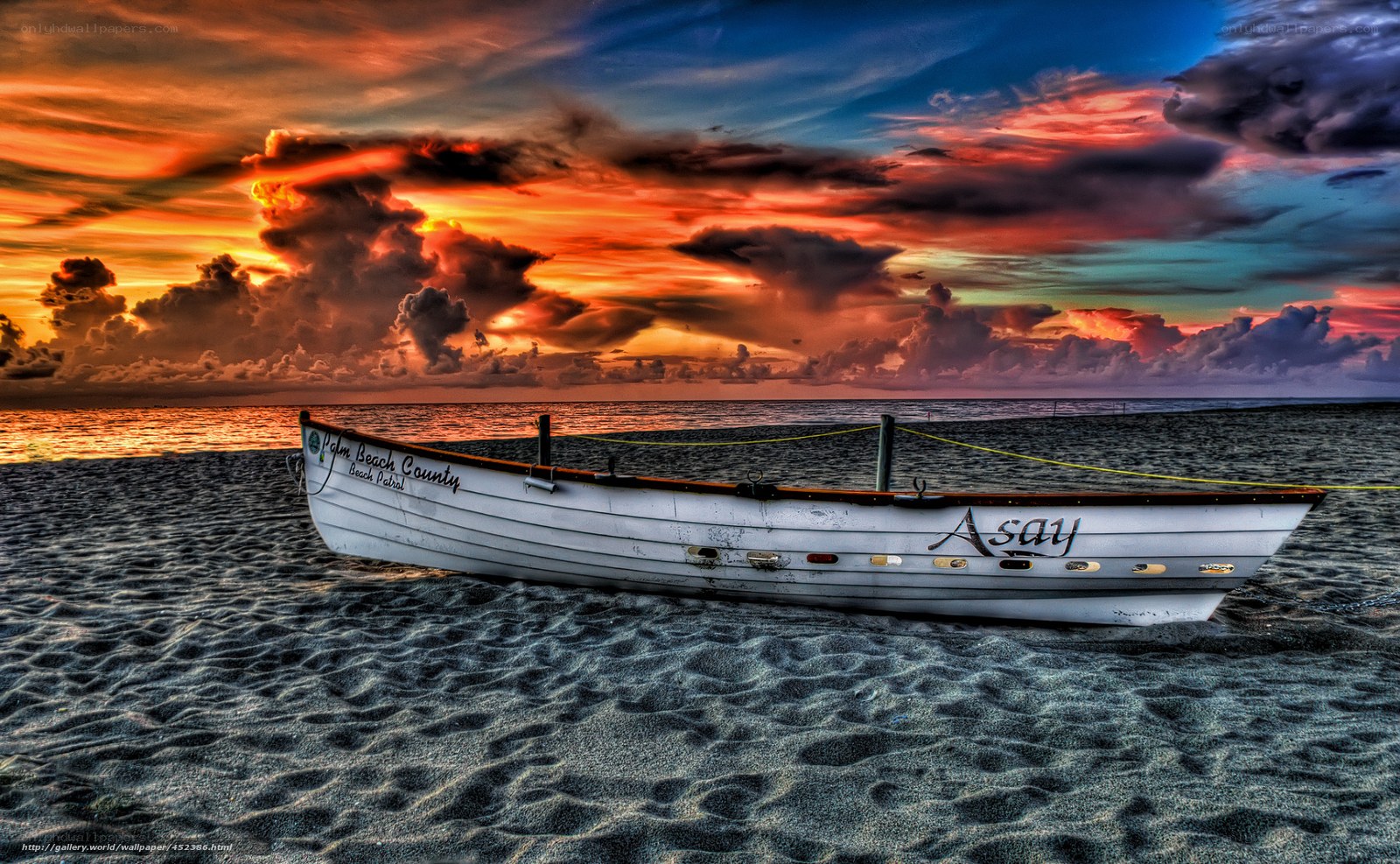Sunset with boat on beach