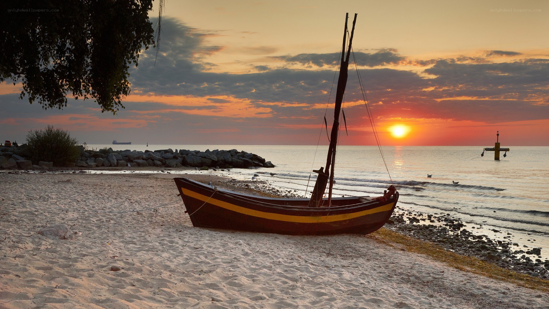 Sunset with boat on beach