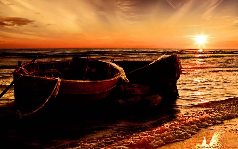 Sunset with boat on shore