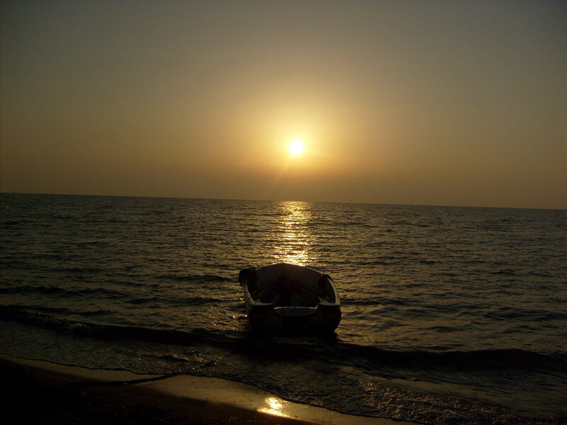 Sunset with boat on shore