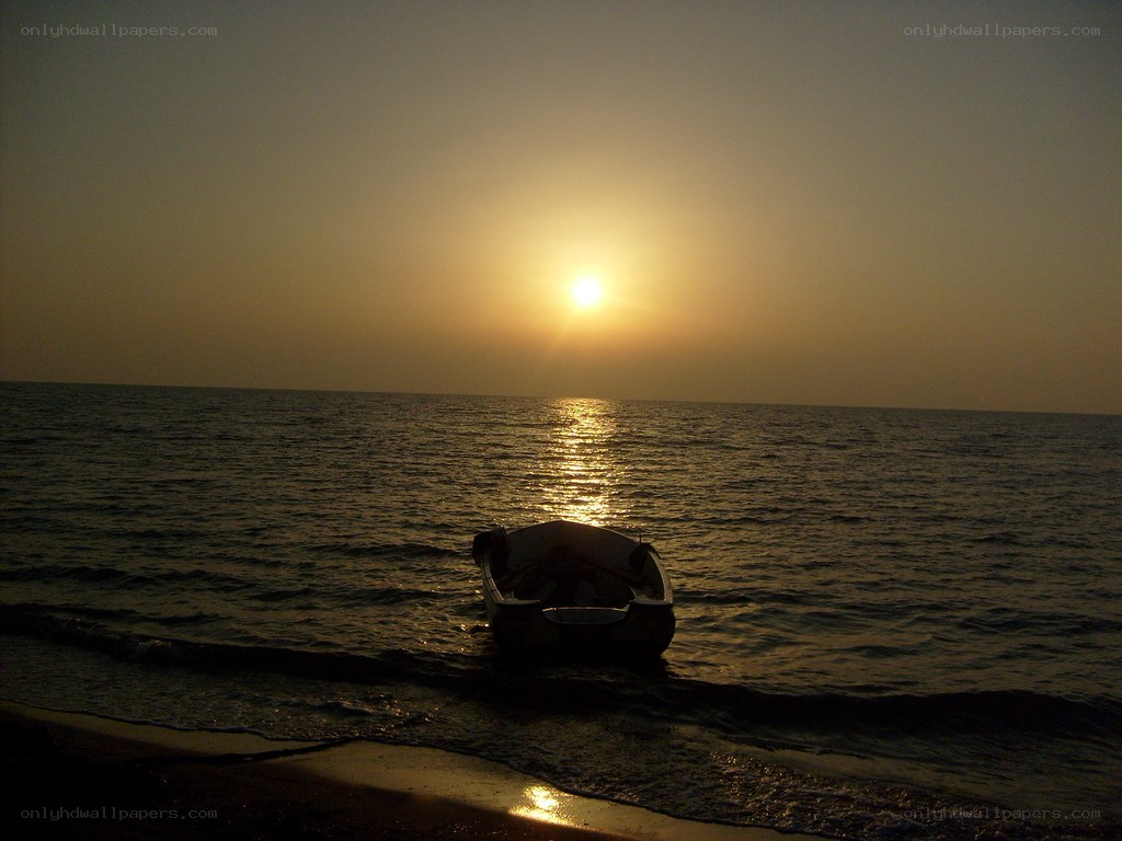 Sunset with boat on shore