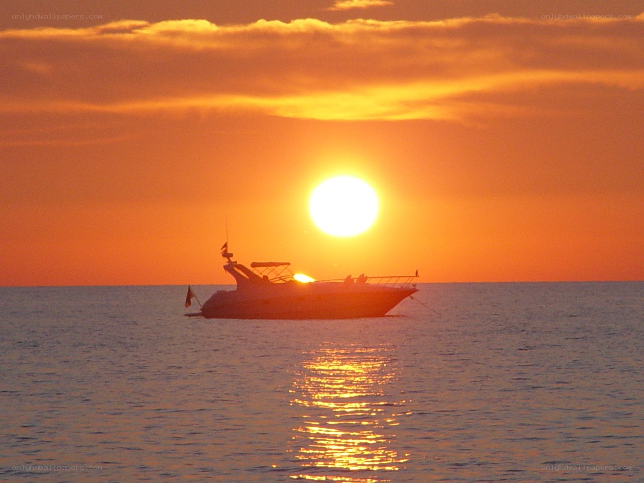 Sunset with boat silhouette