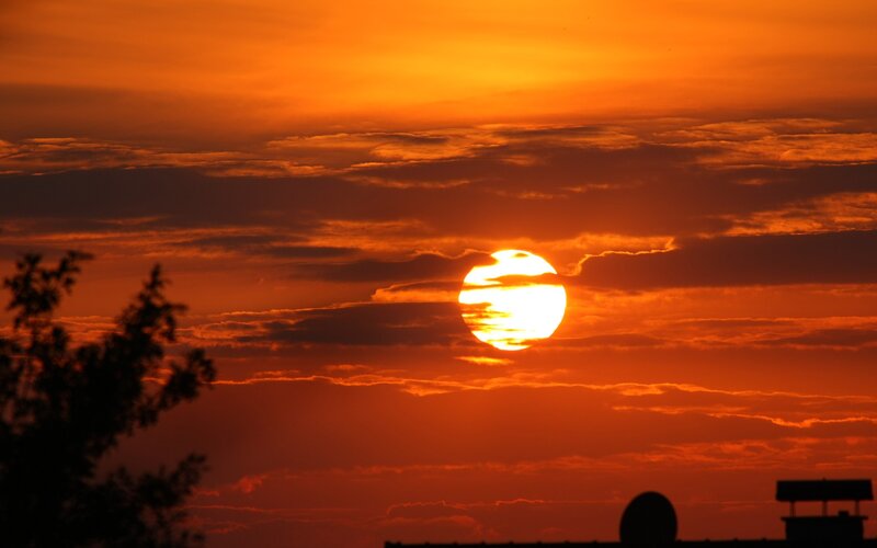 Sunset with clouds and silhouettes