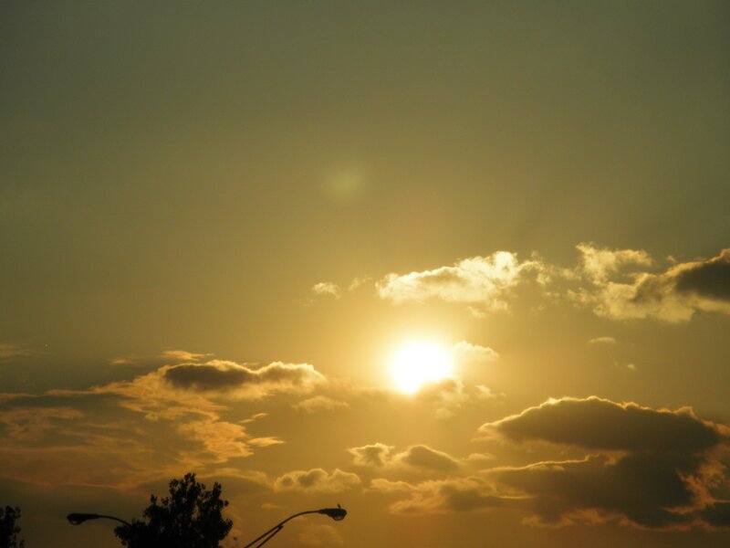 Sunset with clouds and streetlights