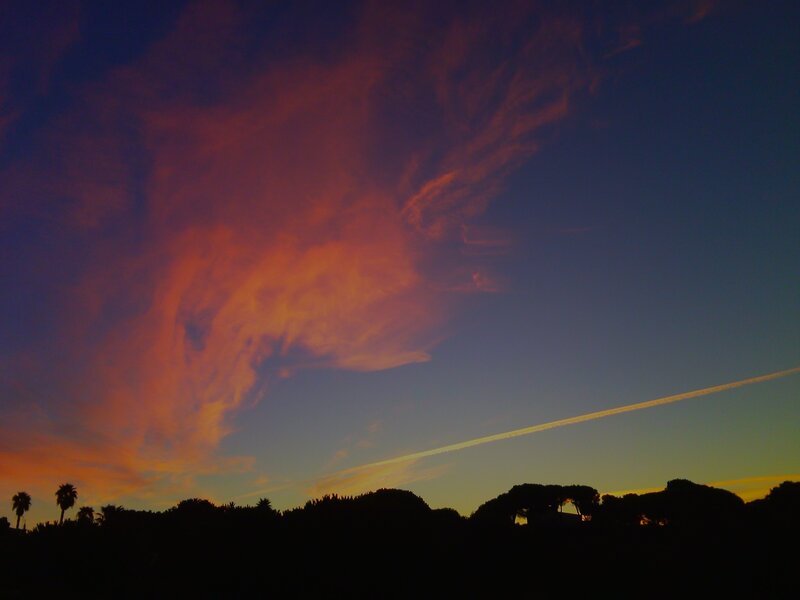 sunset with contrail