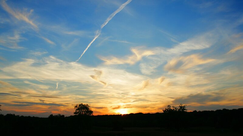 sunset with contrail