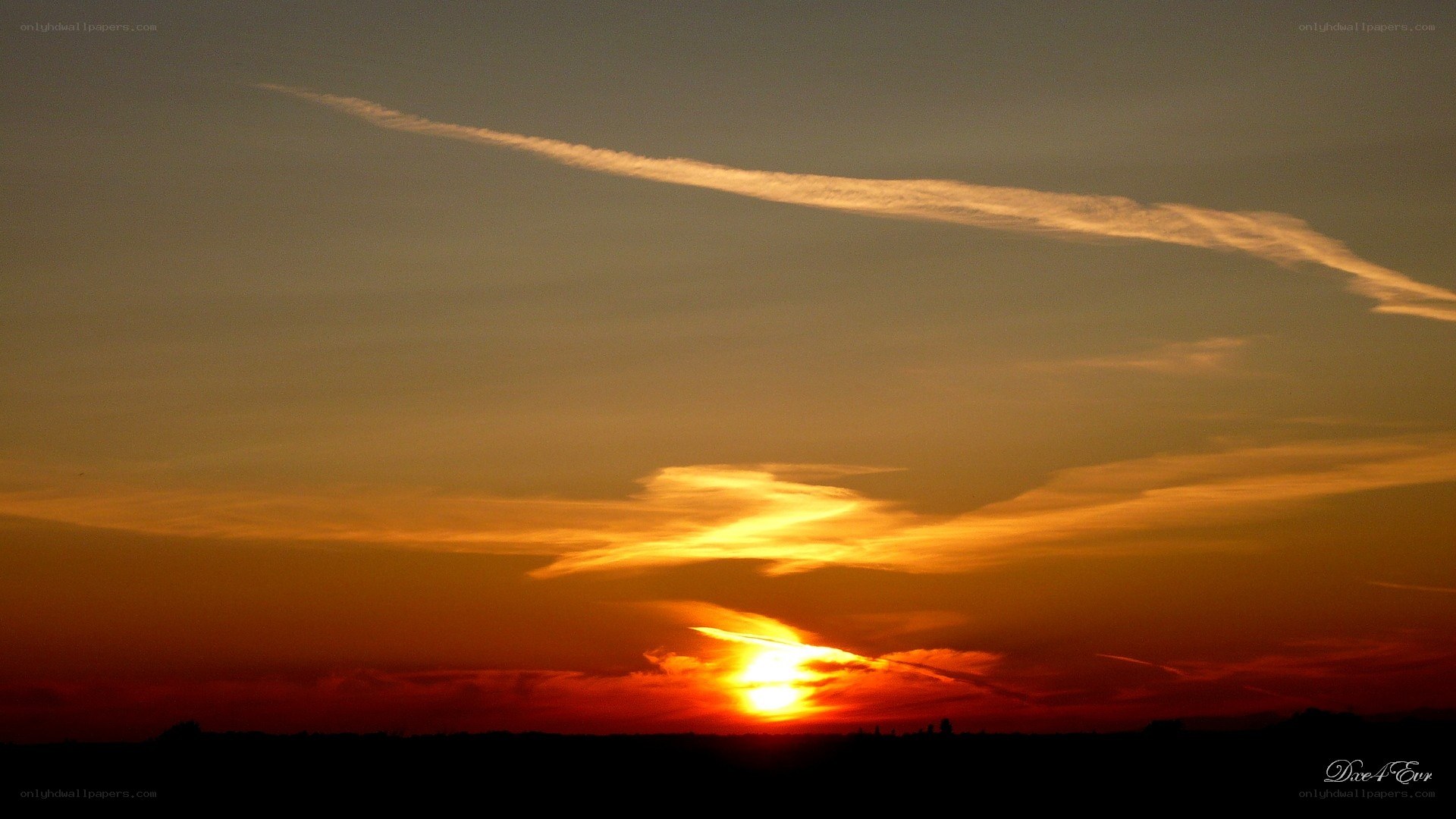 Sunset with contrail