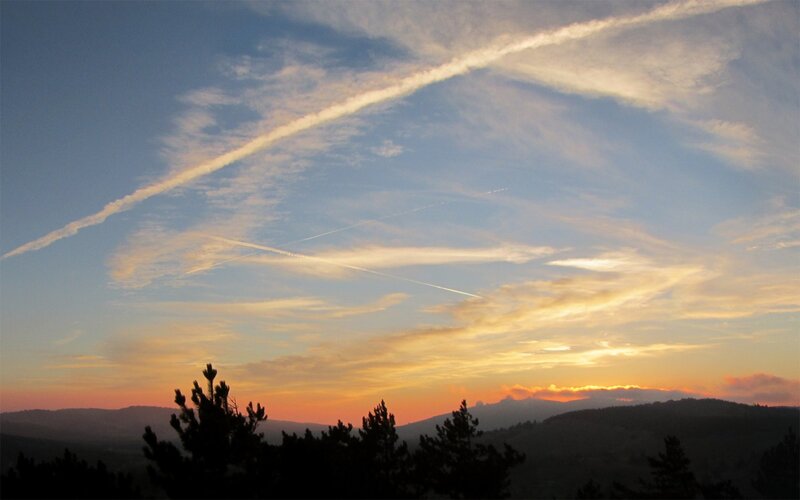 Sunset with contrails
