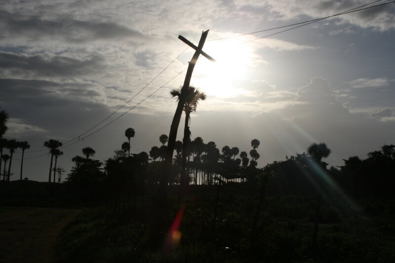 Sunset with cross silhouette