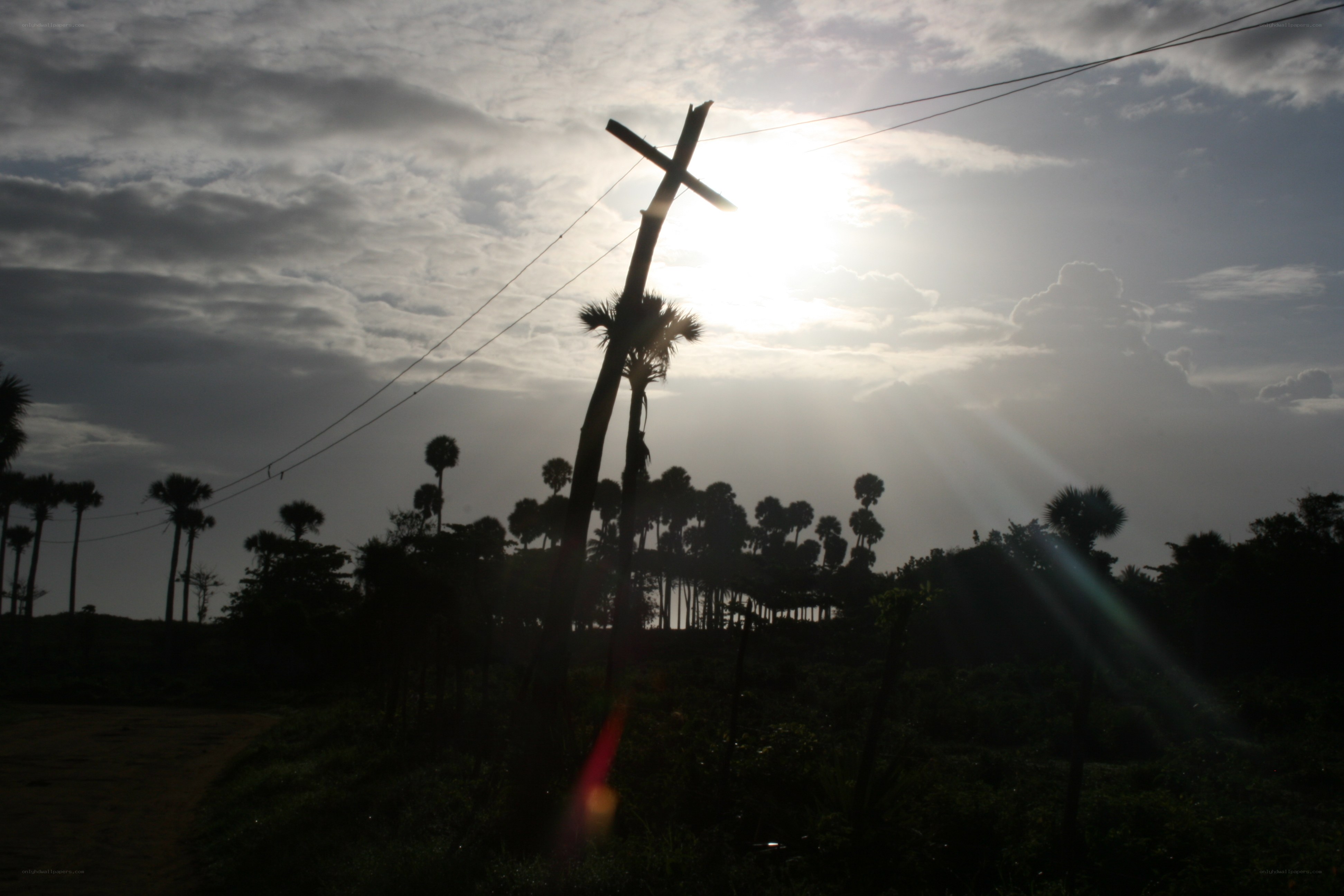 Sunset with cross silhouette