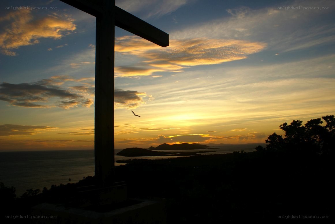 Sunset with cross silhouette