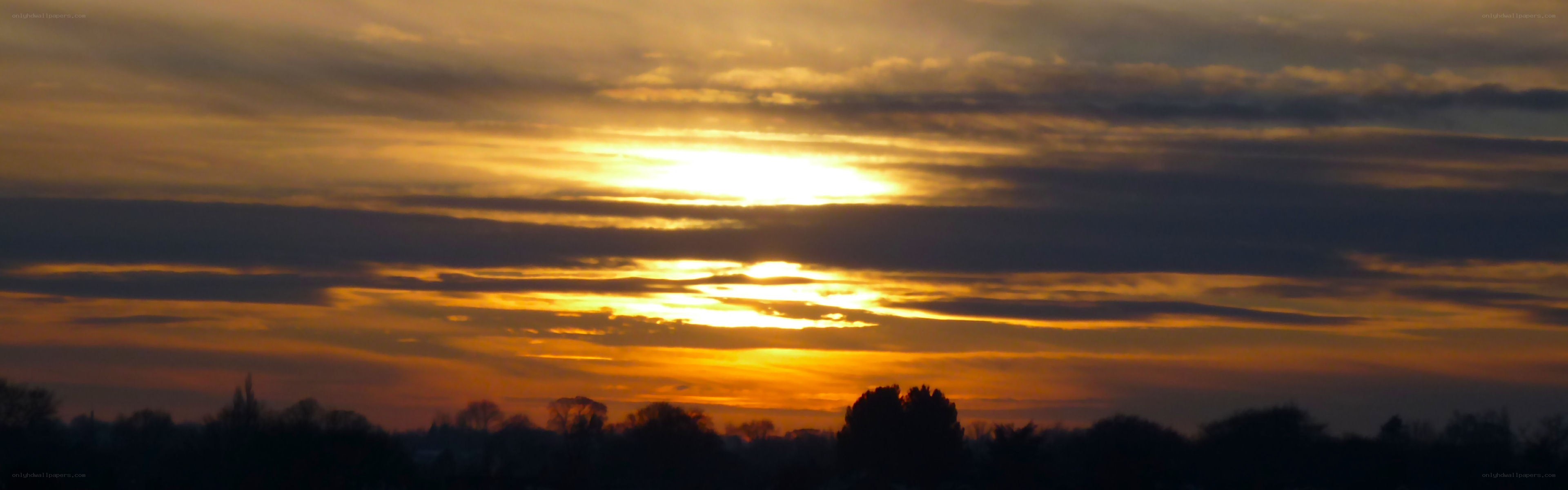 Sunset with golden clouds