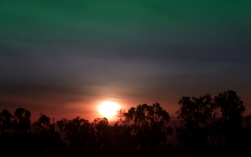 Sunset with green aurora