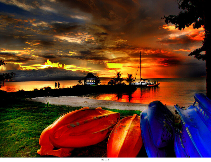 Sunset with kayaks on beach