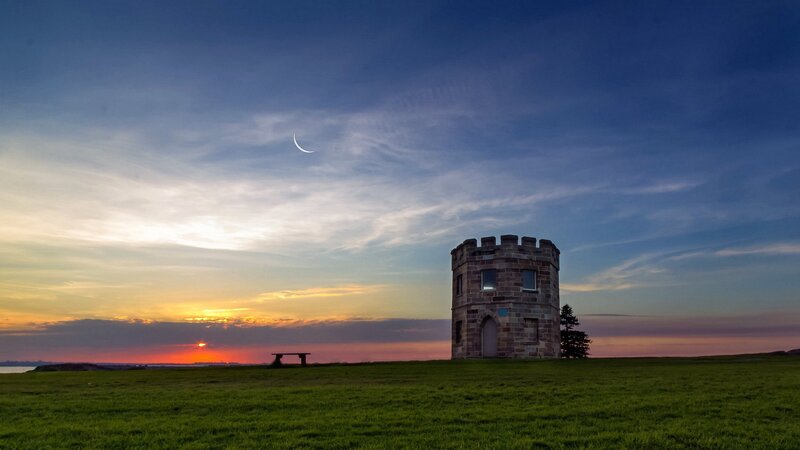 Sunset with moon and tower