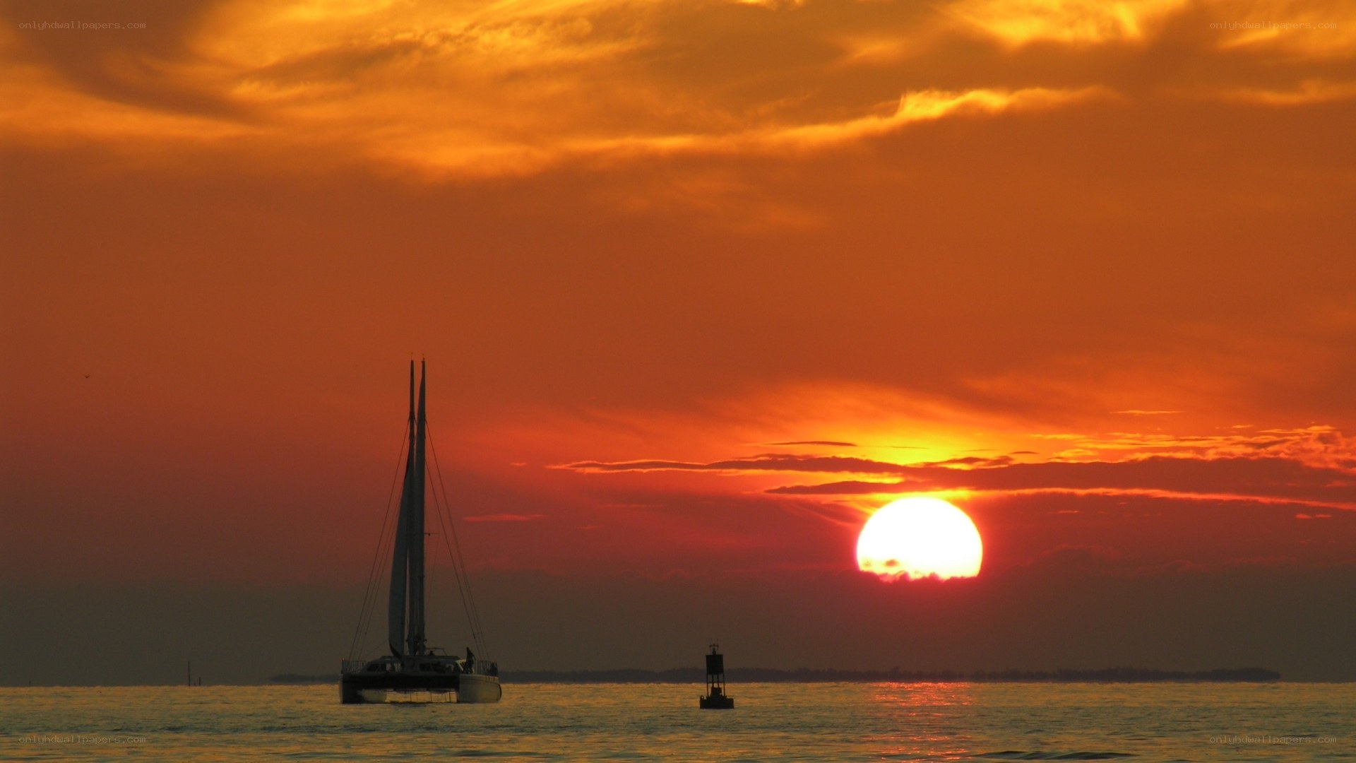 Sunset with sailboat silhouette