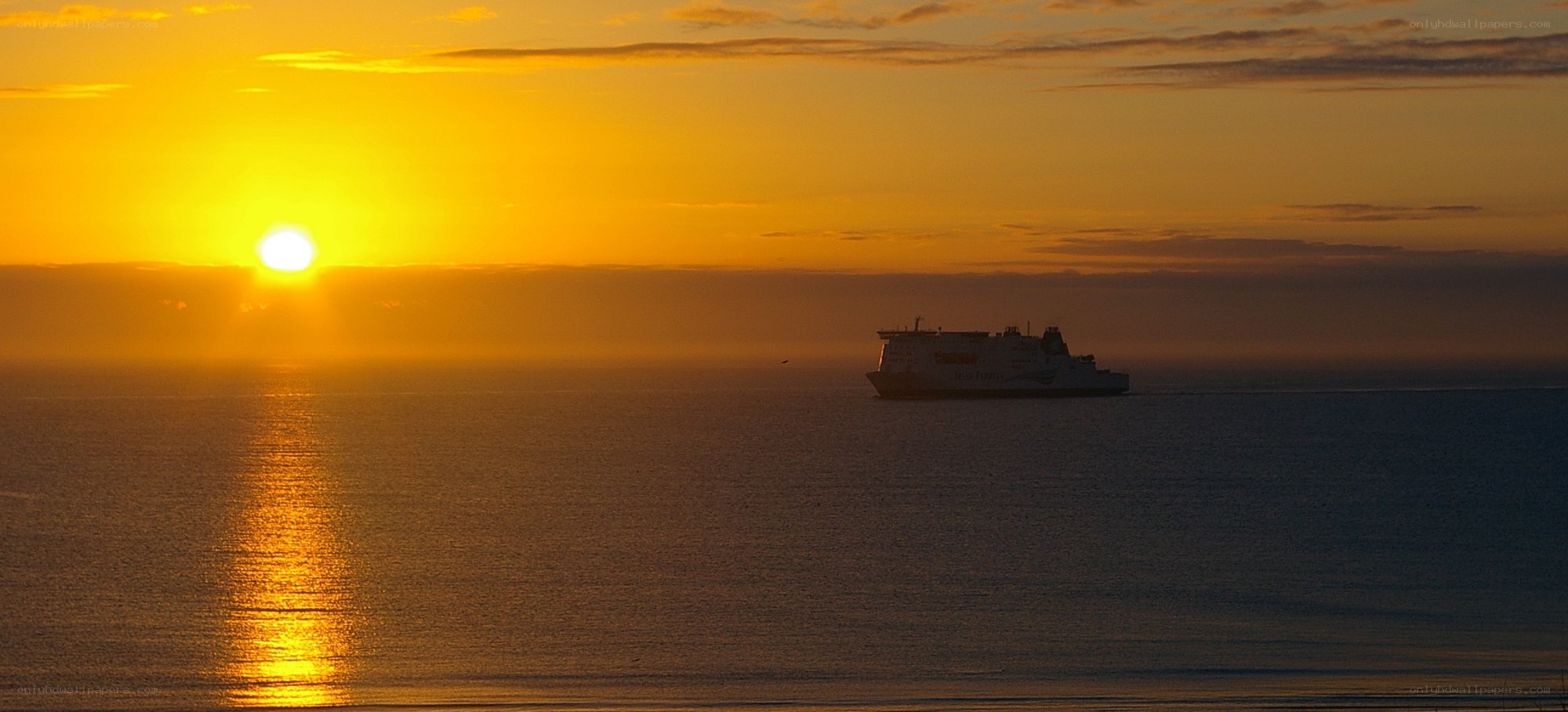 Sunset with ship silhouette