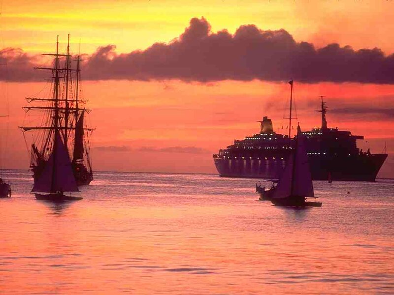 sunset with ships silhouette