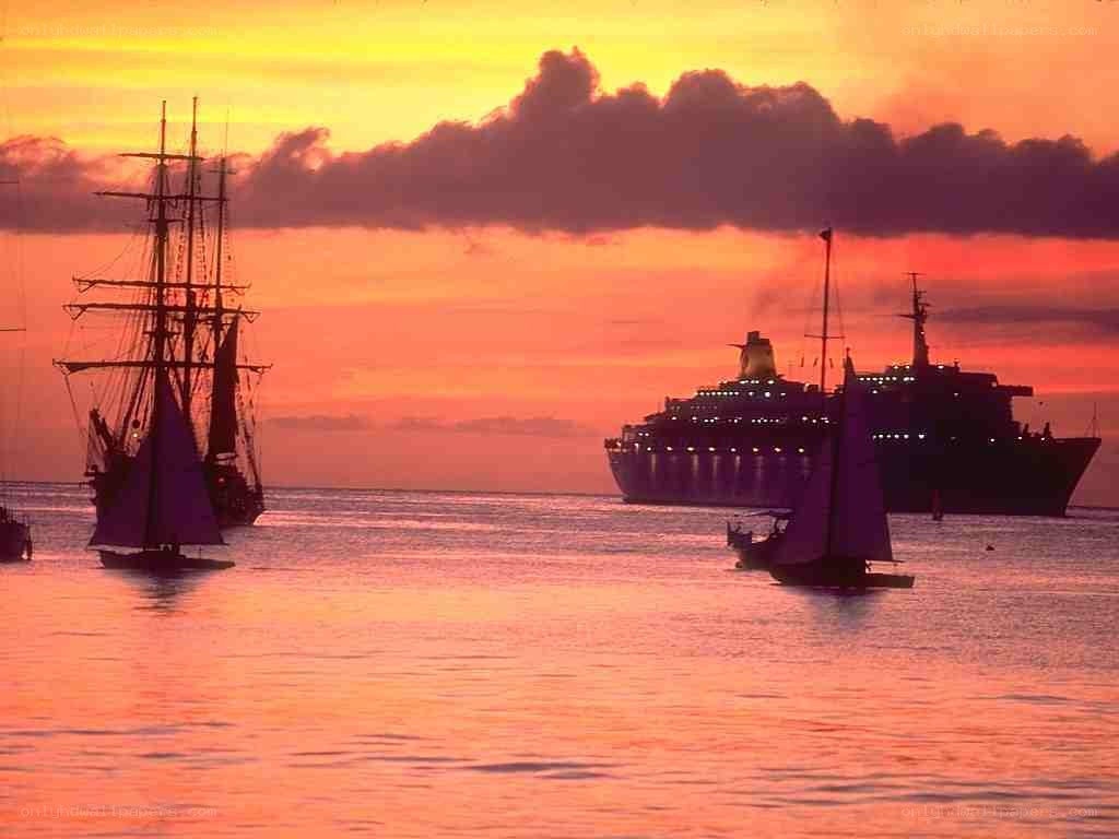 sunset with ships silhouette