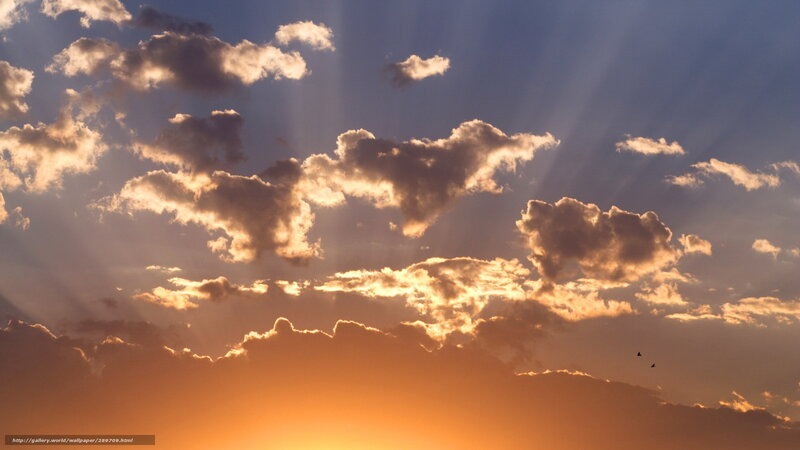 Sunset with sunbeams and clouds