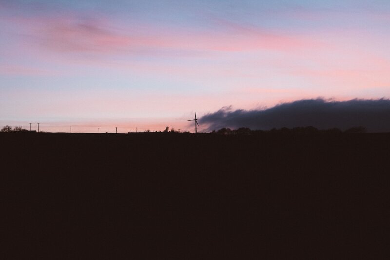 sunset with wind turbine