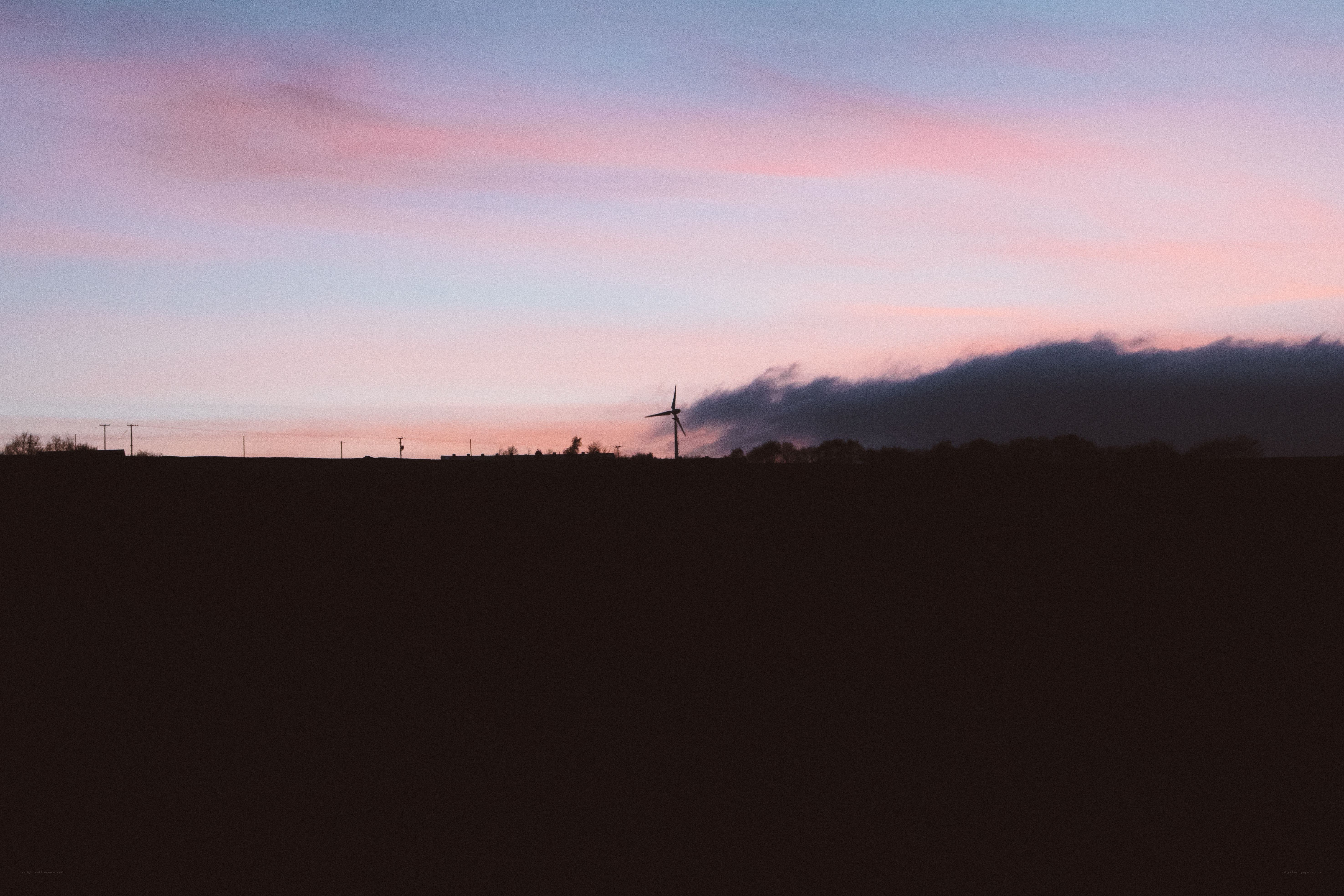 sunset with wind turbine