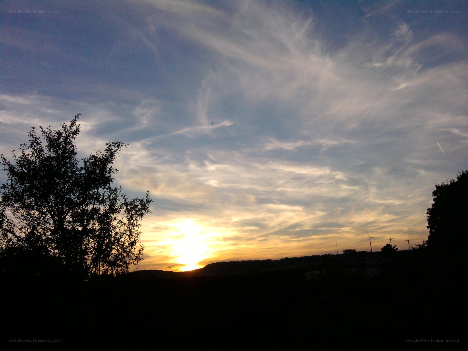 sunset with wind turbines
